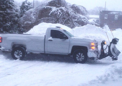 Truck Plowing Snow