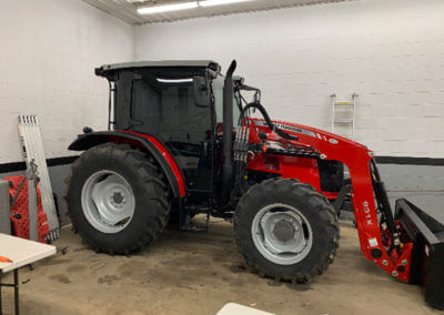 Tractor with Bucket in Garage